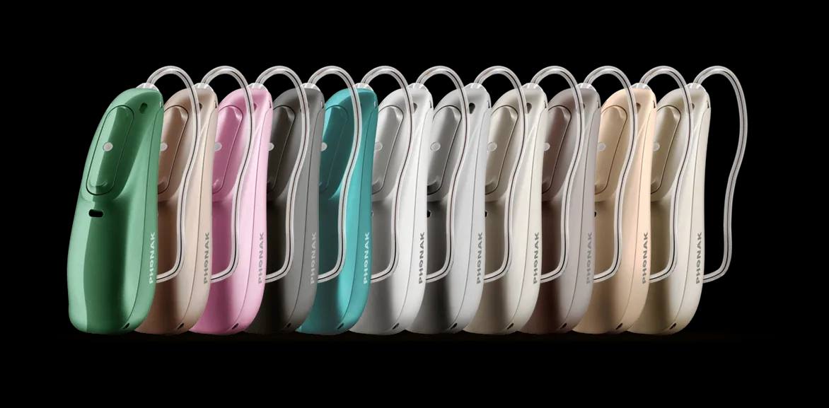 Aparelhos Audéo Lumity lado a lado em várias cores, do verde ao bege, rosa, cinza e champanhe